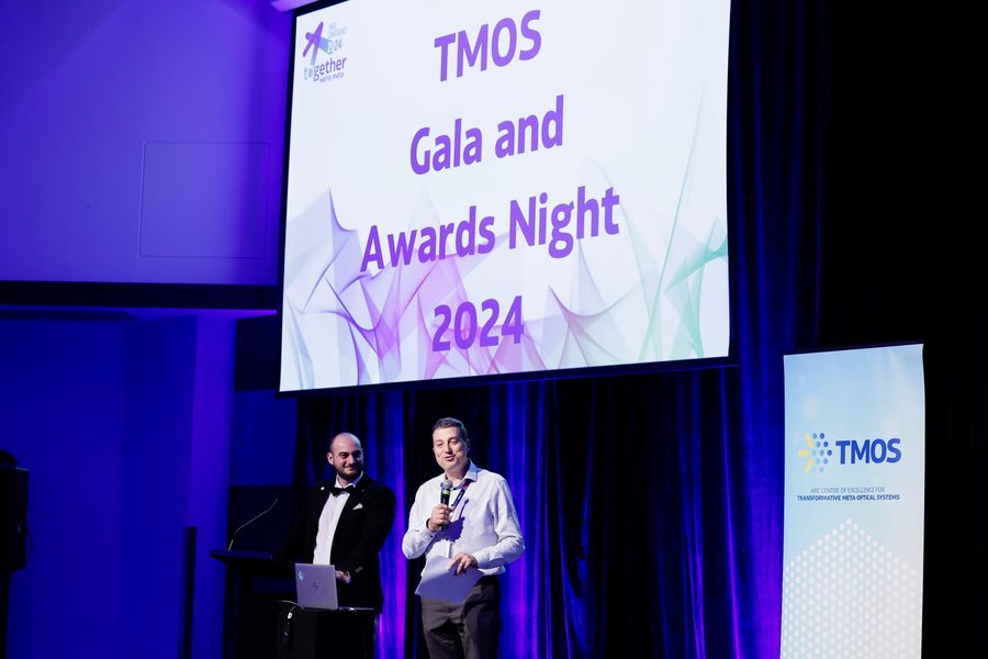 Dr Sulejman in black tie hosting the TMOS Gala and Awards Night 2024 on stage